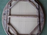 a picture of a wooden frame on the floor