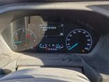 a car dashboard with a speedometer and gauges
