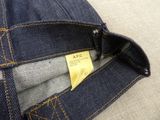 the back pocket of a pair of jeans with a tag on it