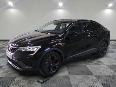 the black suv is parked in the garage on a checkered floor