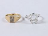 two gold rings with a white diamond and a yellow gold ring