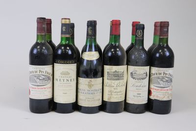six bottles of wine are lined up in a row on a table