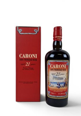 the bottle of caroni 27 year old is next to the box