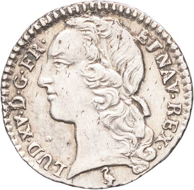 une pièce d'argent portant une tête de femme