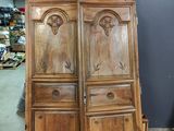 two large wooden doors are stacked on top of each other