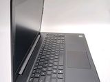 a laptop with a black keyboard on a white surface