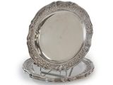 two silver plate with a silver rim and a silver plate with a silver rim
