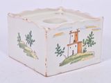 a small white box with a picture of a lighthouse on it