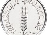 a close up of a silver coin with a picture of a wheat