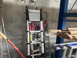 a ladder that is leaning against a wall in a garage