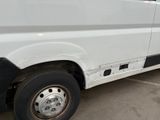 an image of a white van parked in a parking lot