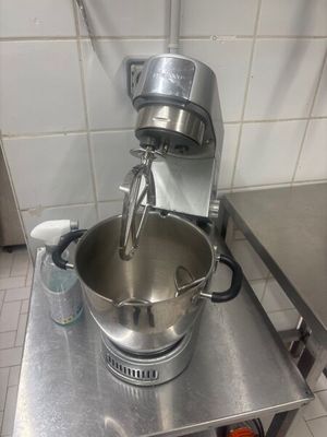 a mixer that is sitting on a table in a kitchen