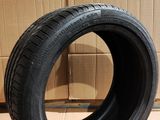 tire on the floor next to a cardboard box and cardboard boxes