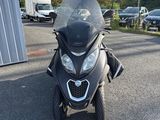 a picture of a motorcycle parked in a parking lot