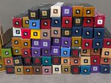 a pile of colorful boxes stacked on top of each other