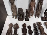 a lot of wooden figurines that are sitting on a table