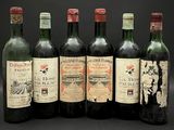 six bouteilles de vin sont alignées sur un fond noir
