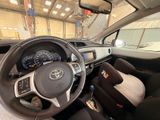 a steering wheel and dashboard of a car inside of a building