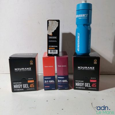 three boxes of nutrazz energy gels and a bottle of nutrazz energy gel