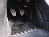 a close up of a car ' s pedals in a vehicle