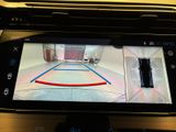 a picture of a car ' s rear view mirror with a camera attached to it