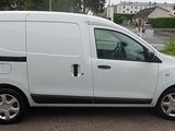 a white van that is parked in a parking lot