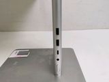 a silver laptop computer sitting on top of a desk