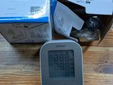 a clock that is sitting on a table next to a box