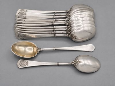 five spoons and two spoons sitting on a table