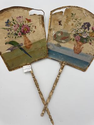 pair of hand painted fan with flowers and birds on them