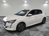 a white car parked on a checkered floor in a garage