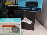 two boxes of wireless devices sitting on a table next to each other