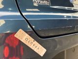 a sticker on the back of a car that has a red teddy bear on it