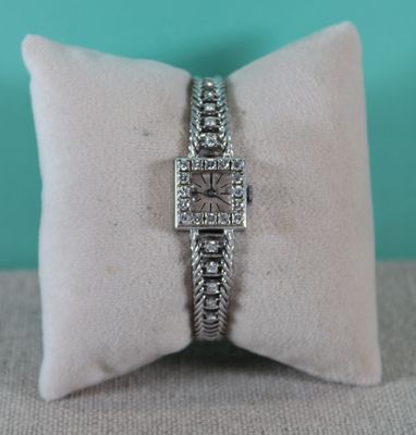a close up of a ring on a pillow on a pillow