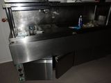 an image of a kitchen with a sink and a stove