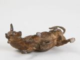 bronze figurine of a bull with horns on a white background