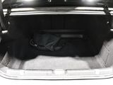 a trunk of a car with a black bag in it