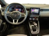 the interior of a car with a steering wheel, dashboard, and dashboard controls