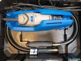 an image of a blue vacuum cleaner in a black container