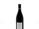 a bottle of wine that is sitting on a table