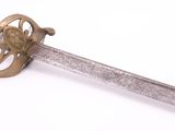 a sword with a heart on it on a white surface