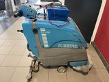 a blue machine that is sitting on the floor