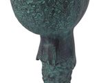 statue of a boy with a ball on his head