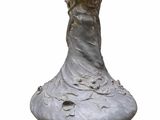 a statue of a woman in a dress on a pedestal