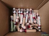 a cardboard box filled with various types of lip bales