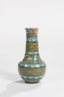 a vase that is sitting on a white surface