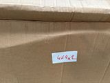 a cardboard box with a sticker on it sitting on the floor
