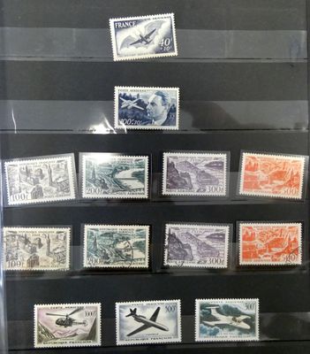many different stamps on display in a glass case