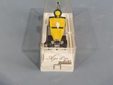 a small toy of a police officer sitting in a box