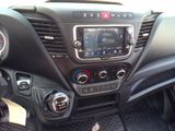 the dashboard of a car with a digital display in the center of it